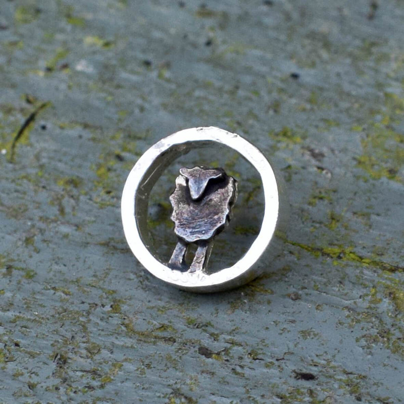 Silver circle black sheep lapel pin