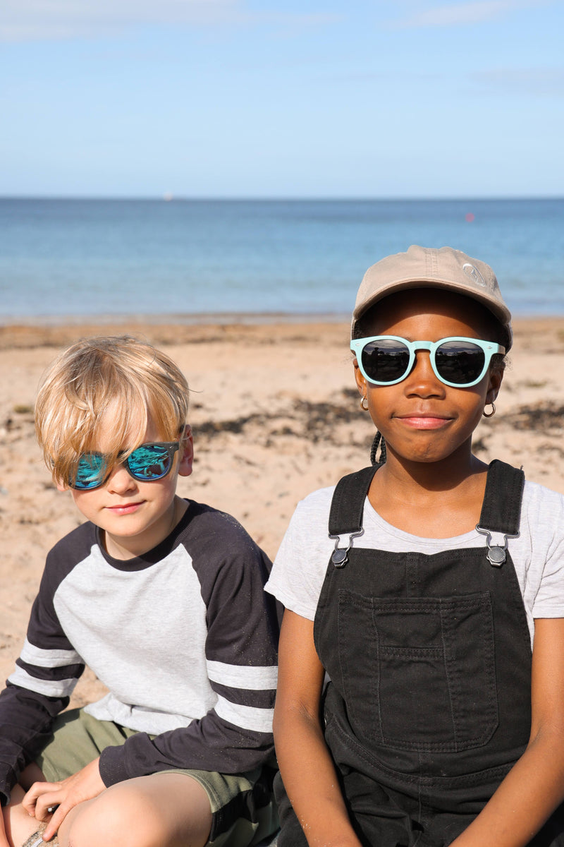 Made with a sustainable speckled wheatstraw frame with walnut wood temples, it's lightweight and comfortable. Fitted with UV400 polarised lenses. Our large child/teen/small adult frame and provides a neater fit without compromising on eye protection.