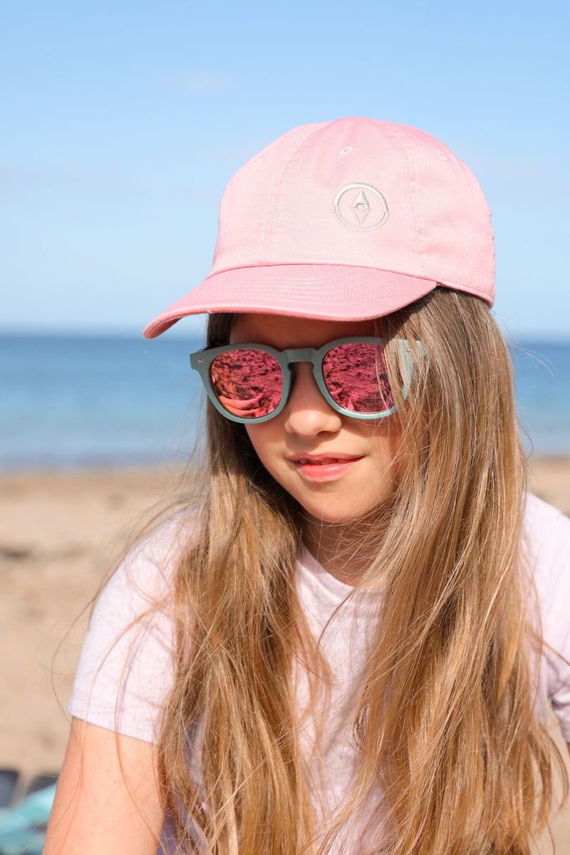 Made with a sustainable speckled wheatstraw frame with walnut wood temples, it's lightweight and comfortable. Fitted with UV400 polarised lenses. Our large child/teen/small adult frame and provides a neater fit without compromising on eye protection.