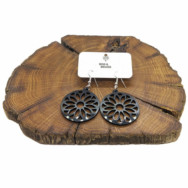 Black flower design circle earrings in acrylic