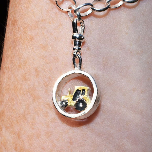 Gold tractor charm