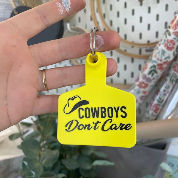 ‘COWBOYS DON’T CARE’ Cattle Tag Keyring
