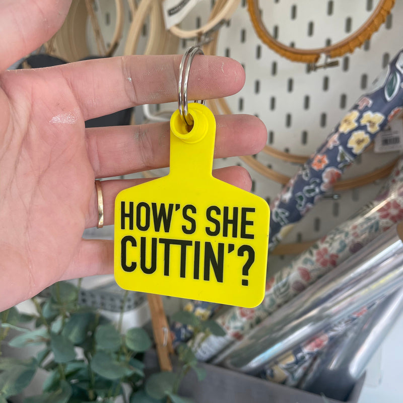 ‘HOW’S SHE CUTTIN?’ Cow Tag Keyring