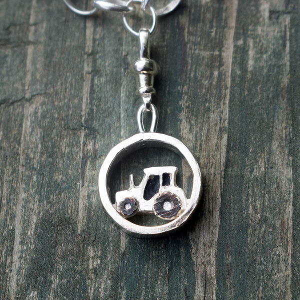 Silver tractor charm