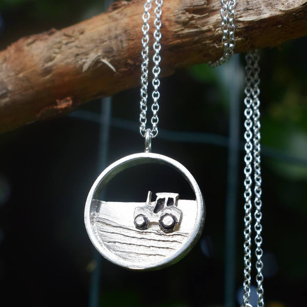 Silver tractor necklace